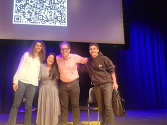 Panel visit with student give-away